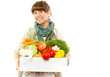 An attractive smiling woman holding a grocery bad on white