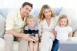 Adorable family watching tv Adorable family watching tv