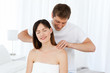 Photo: Man giving massage to his wife Man giving massage to his wife