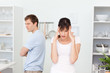Photo: Young lovers having dispute in the kitchen Young lovers having dispute in the kitchen
