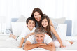 Photo: Happy familly looking at the camera Happy familly looking at the camera