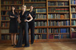 Three lawyers in library, standing