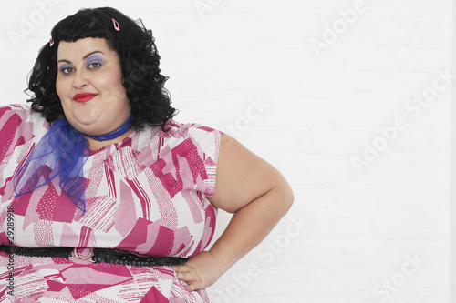 Photo: Overweight Woman posing with hands on hips, portrait Overweight Woman posing with hands on hips, portrait