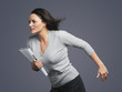 Determined Young Businesswoman, leaning into wind