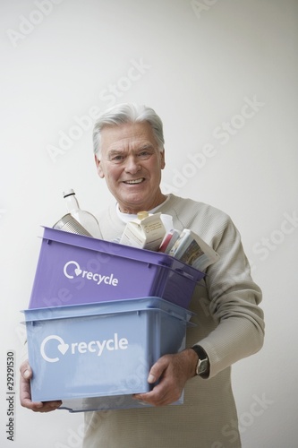 Photo: Senior Man Carrying Recycling Bin Senior Man Carrying Recycling Bin