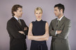 Businesswoman surrounded by businessmen, portrait
