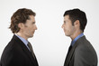 Businessmen face to face, on white background