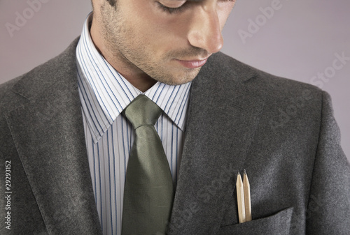 Foto: Young businessman with pencils in pocket, portrait Young businessman with pencils in pocket, portrait