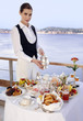 Waitress with breakfast table
