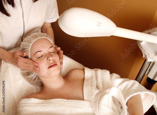 Photo: Woman having a facial treatment at a spa Woman having a facial treatment at a spa