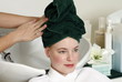Young woman  having her hair  washed at a salon
