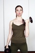 Young woman lifting weights