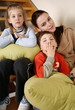 Mother with tired children on staircase