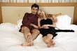 Couple relaxing in bed