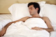 Man sleeping in bed