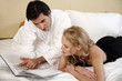 Couple relaxing in bed