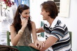 Couple at a table together Couple at a table together