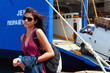 Young woman in front of ferry