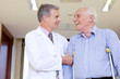 Doctor assisting a disabled senior