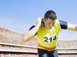 Athlete shot putting in an arena