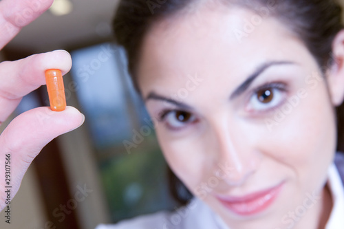 Photo: Woman with a pill portrait Woman with a pill portrait