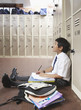 A student studying in the school hallway