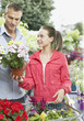 Man and girl shopping for flowers
