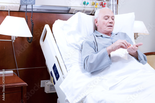 Photo: Patient taking pills Patient taking pills