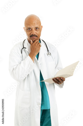 Photo: Serious Doctor Considers Options Serious Doctor Considers Options