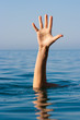 Photo: single hand of drowning man in sea asking for help single hand of drowning man in sea asking for help