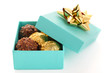 Gift box with chocolate truffle on white background isolated Gift box with chocolate truffle on white background isolated