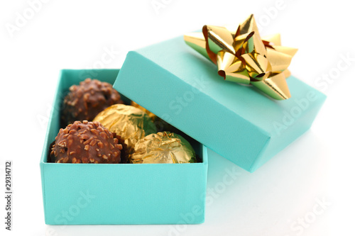 Photo: Gift box with chocolate truffle on white background isolated Gift box with chocolate truffle on white background isolated