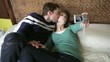 young couple taking snapshots with camera