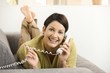 Happy woman chatting on phone