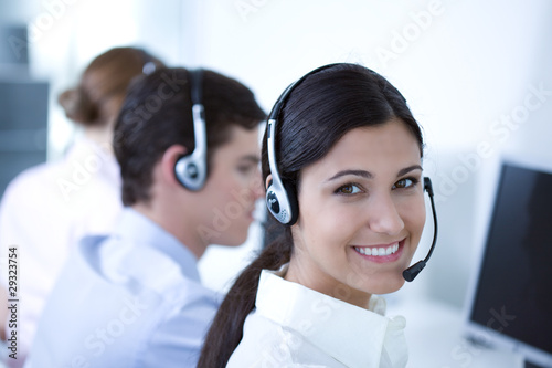 Photo: Young adults working in a call center Young adults working in a call center