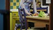 woman cooking vegetables in domestic kitchen