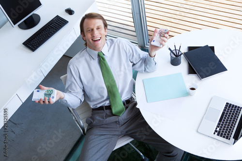 Photo: Happy businessman with euros Happy businessman with euros