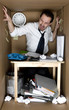 Foto: Man in the small office cardboard box. Man in the small office cardboard box.