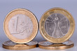 The obverse and reverse of coins of one euro The obverse and reverse of coins of one euro