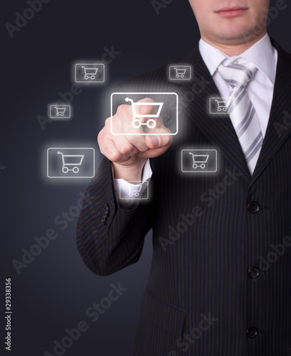 Photo: Man pressing shopping cart icon Man pressing shopping cart icon