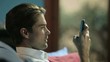man typing sms on cellphone