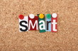The word Smart in magazine letters on a notice board The word Smart in magazine letters on a notice board