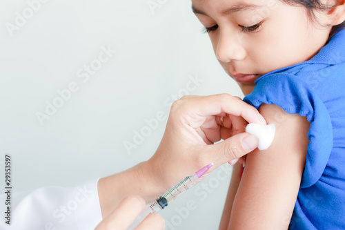 Photo: Boy and vaccine syringe Boy and vaccine syringe