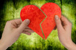 love and divorce. two hands holding broken heart