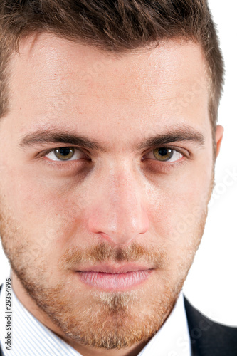 Photo: Serious businessman portrait on white background Serious businessman portrait on white background