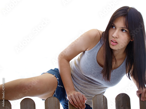 Photo: girl climbing over the fence girl climbing over the fence