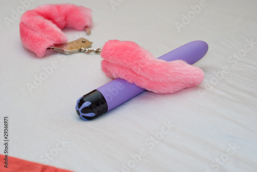 Photo: Pink fluffy cuffs and vibrator Pink fluffy cuffs and vibrator