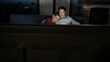 man and woman watching movie on tv