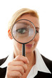 business woman with magnifying glass to the eye