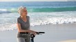 Aged woman waiting with a bike